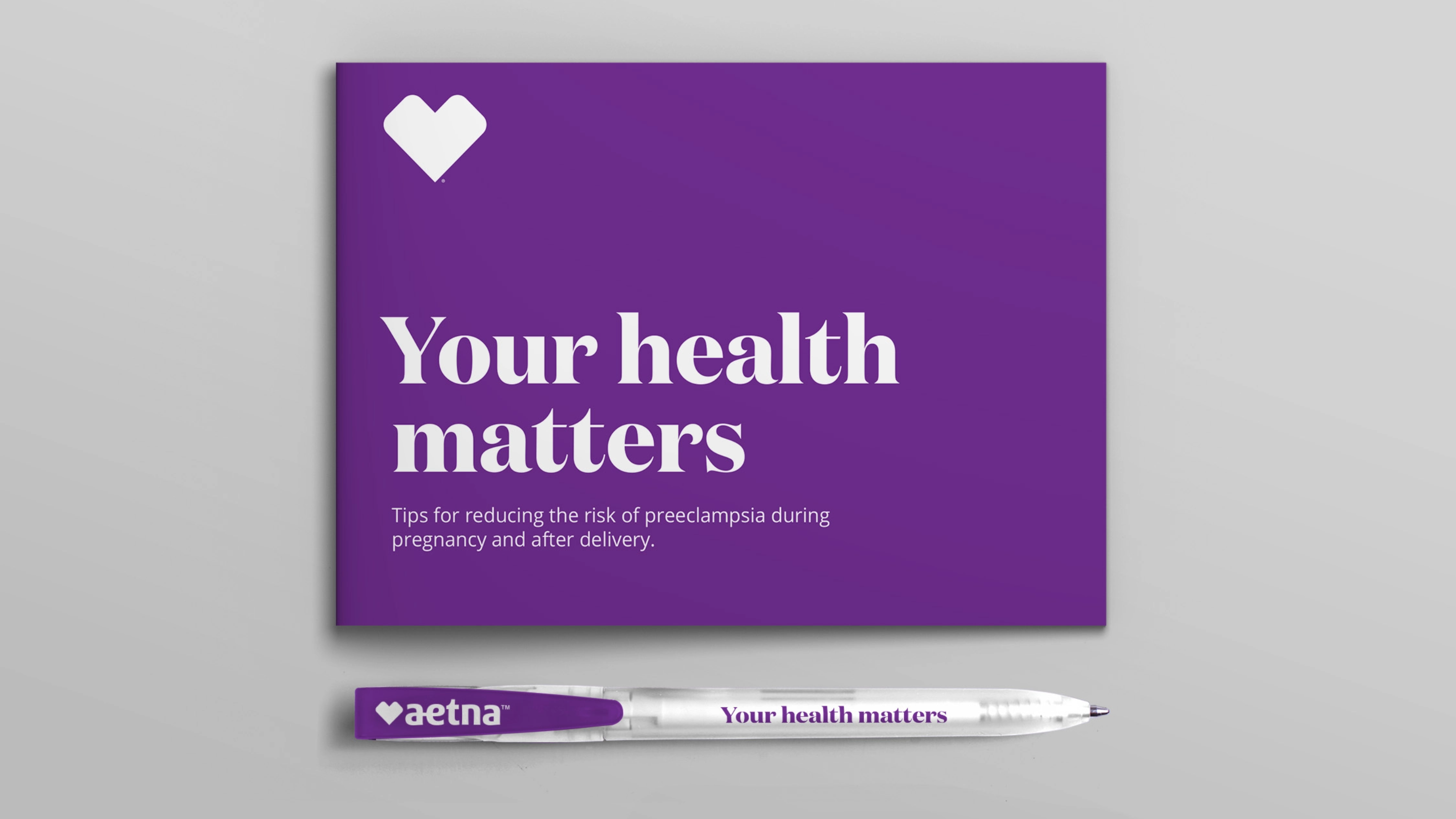 The Aetna "Your health matters" motto on a booklet and pen.