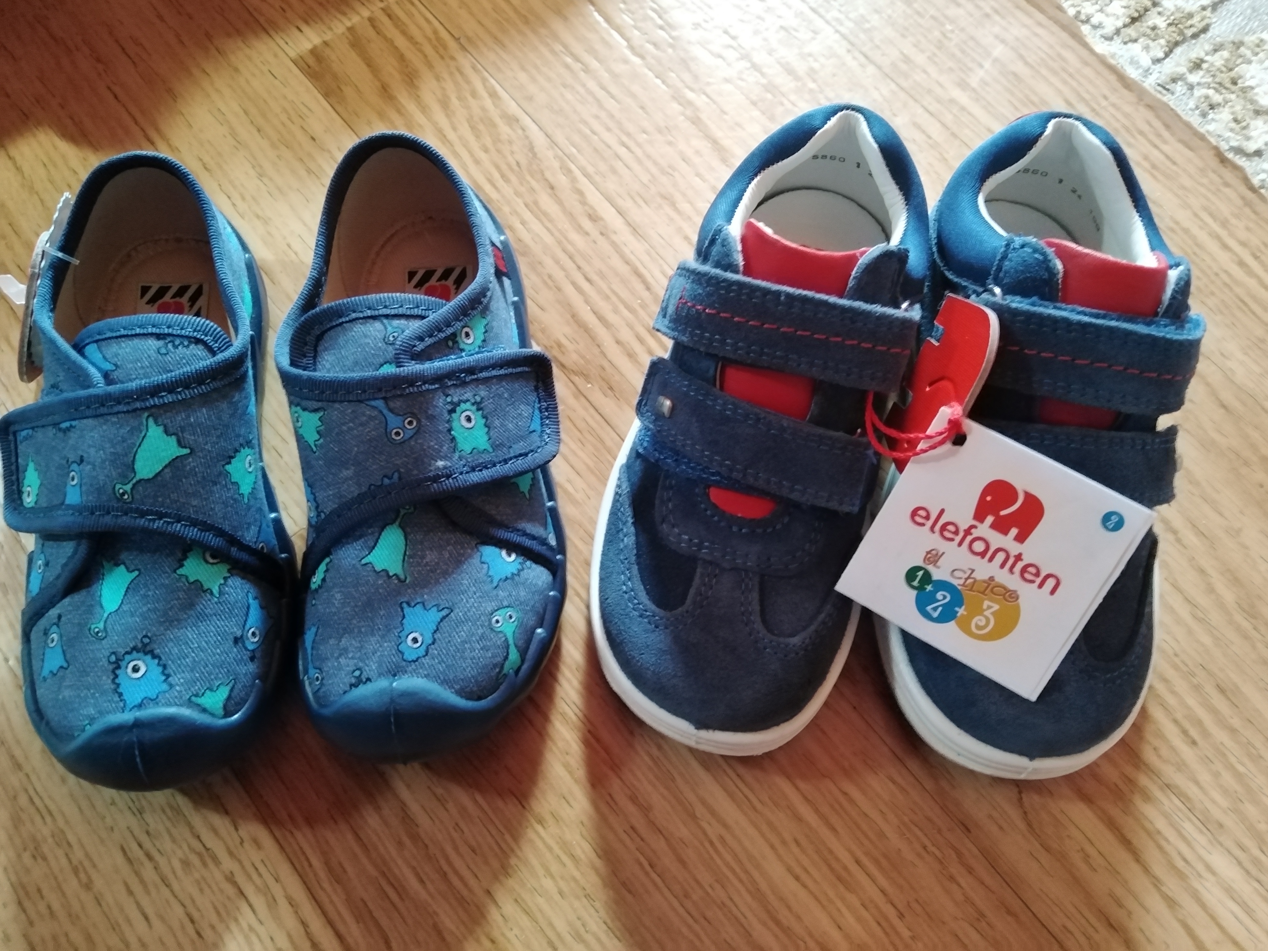 Two pairs of children's shoes.